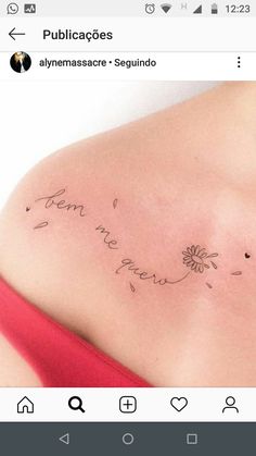 the back of a woman's shoulder with writing on it