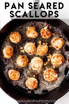 cooked scallops in a skillet on a white counter with black spatula