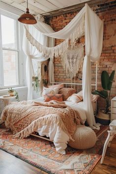 a bedroom with brick walls, white curtains and a canopy bed in the middle of it