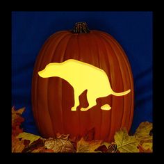 a carved pumpkin with an image of a dinosaur on it