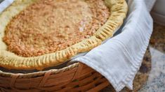 a pie sitting in a basket on top of a counter