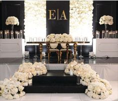 an elegant wedding setup with white flowers and candles