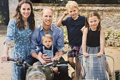 the family is posing for a photo on their motorcycle