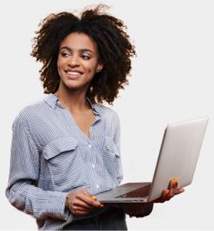 a woman holding a laptop computer and smiling