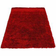 a red rug is shown on a white background with no one in it or someone else