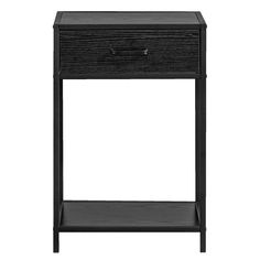 the side table is black and has a drawer on one end, and a shelf on the other