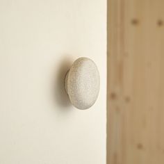 a stone is mounted to the wall next to a door