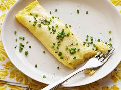 an omelet on a plate with a fork