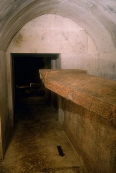 an underground tunnel with a bench in it