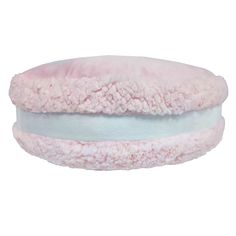 a pink and white pillow with fluffy edges