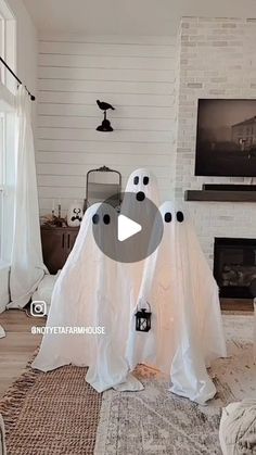 a living room decorated for halloween with ghost decorations