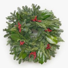 a wreath with red berries and green leaves