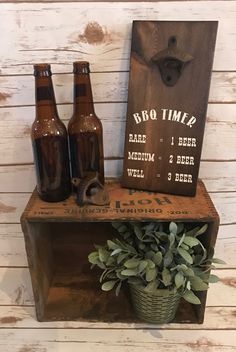 three beer bottles sitting on top of a wooden crate next to a sign that says, pro time