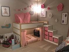 a bedroom with a loft bed and pink curtains