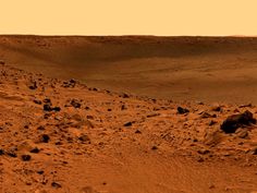 an image of some rocks and dirt in the middle of the desert with no one on it