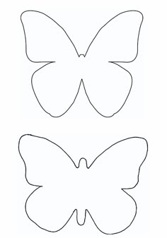 two paper butterflies cut out to make them look like they are facing each other and one is