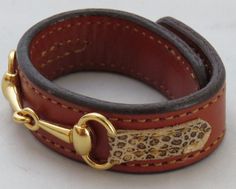 a close up of a dog collar on a white surface