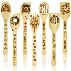 six wooden spoons with different designs and words on them, all in various shapes and sizes