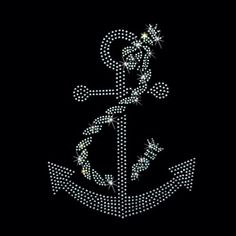 an anchor made up of diamonds on a black background with the word love written in it