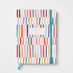 a notebook with colorful stripes on it