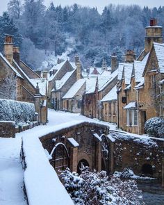 snow covers the rooftops and roofs of old buildings