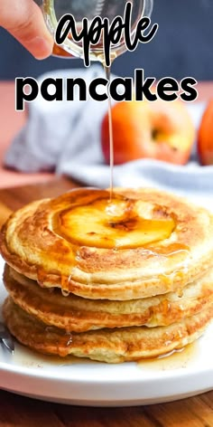 a stack of pancakes with syrup being drizzled on top