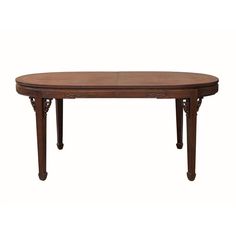 an oval wooden table with carved legs