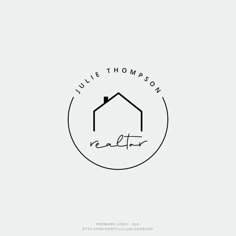 the logo for julie thomas realty, which is located on top of a white background