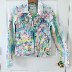 Neon splatter denim reworked jean jacket, glows in black light!! This is a sz xs but is a good fit for xxs-xs !! Jacket is amazing and will look great with a tan Neon is so in  Get it while you can !! Wash in cold water separately and hang to dry iron when needed Neon Carnival, Bleach Denim, Reworked Jeans, Cycling T Shirts, Tie Dye Jeans, Crop Jean Jacket, Tie Dye Crop Top, Bleached Denim, Womens Jackets