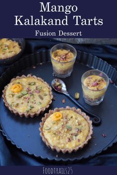 three desserts on a black plate with text overlay reading mango kalakaki and tarts