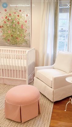 a baby's room is decorated in pink and white