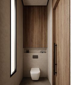 a bathroom with a toilet and wooden walls