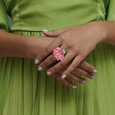 It's a testament to nature's artistry. Delicately enameled to mimic the soft hues of blooming flowers, this adjustable ring is a celebration of femininity and strength. Each petal is a brushstroke of elegance, capturing the essence of a blossoming lotus. With Blossomira, wear the beauty of nature on your finger FEATURES: Handmade in Chicago 22k Gold Plating on Hypoallergenic Metals Hand Painted Enamel One size fits all (adjustable ring) Dimension: 1.2" x 1" Weight: 10 gms NOTE: Each piece is han Blooming Lotus, Enamel Ring, Pink Ring, Blooming Flowers, 22k Gold, Adjustable Ring, Adjustable Rings, Gold Plating, Deodorant