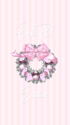 a pink christmas card with a wreath and bow