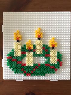 legos are made to look like ducks in the water, with yellow and red flowers on