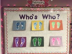 a bulletin board with paper cut out of footprints and the words who's who?