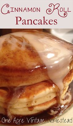 cinnamon roll pancakes on a plate with icing drizzled over them and the words, cinnamon roll pancakes