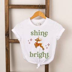 Looking for a cute tee for your kids? We have the perfect Shine Bright Deer graphic tee addition to their closet! Also available in youth tees. Deer Graphic, Holiday Graphics, Toddler Tees, Shine Bright, Holidays With Kids, Sleeve Styles, Fitness Fashion, Top Shirt, Short Sleeve Tee