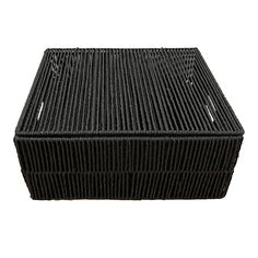 a large black basket sitting on top of a white surface