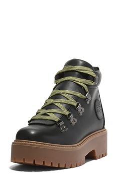 An OrthoLite® insole will keep feet comfortable and cushioned in this chunky lace-up boot balanced on a boosted lug sole. Lace-up style Removable OrthoLite insole Leather and ReBOTL upper/ReBOTL lining/rubber sole Made with one or more components consisting of ReBOTL material that contains at least 40% recycled plastic from post-consumer plastic bottles Imported Regenerative Agriculture, Timberland Women, Platform Boots Women, Stone Street, Hiker Boots, Fall Wardrobe Essentials, Timberlands Women, Baby Boy Shoes, Boy Shoes