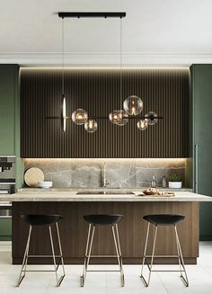 an image of a modern kitchen setting with bar stools and pendant lights over the island