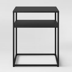 a black side table with two shelves on each side and one shelf in the middle