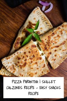 two pita breads on a wooden plate with onions