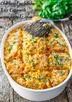 a casserole dish filled with corn and meat