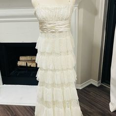 This Is A Beautiful Dress That I Wore Just One Time For My Wedding. I Had It Dry Cleaned So It Is Clean And In Perfect Condition! It Has Spaghetti Straps And An Empire Waist With A Long Satin Ribbon That Can Be Tied In The Back Or Wrapped Around The Waist And Tied In The Front. I Am 5’9” Wearing Flat Shoes. Lace Maxi Dress With Spaghetti Straps For Wedding, Elegant Wedding Dress With Spaghetti Straps, Wedding Gown With Lace Bodice And Spaghetti Straps, Sweetheart Neckline Maxi Dress With Ruffles For Wedding, Wedding Maxi Dress With Sweetheart Neckline And Ruffles, Wedding Maxi Dress With Fitted Bodice And Spaghetti Straps, White Spaghetti Strap Formal Gown, Elegant Wedding Dress With Spaghetti Straps And Fitted Bodice, Sleeveless Dress With Lace Bodice For Beach Wedding