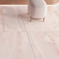 a white chair sitting on top of a pink marble floor