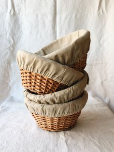 three wicker baskets stacked on top of each other