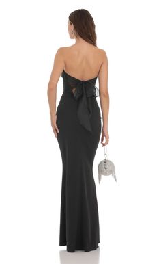 Back Bow Strapless Maxi Dress in Black | LUCY IN THE SKY Black Wedding Guest Dresses, Black Tie Wedding Guest Dress, Black Tie Wedding Guests, Strapless Prom Dress, Strapless Prom Dresses, Simple Prom Dress, Lucy In The Sky, Black Dress Formal, Black Strapless Dress