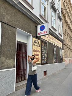 a person taking a photo in front of a building