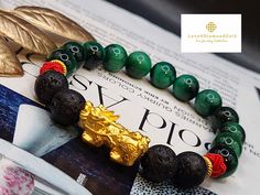 Gift yourself or your love once this 24 Karat Gold Lucky  Pi Xiu Bracelet.  *Materials: 24 Karat Gold, Lava, Lucky String, and Tiger's Eye Stone. *Karat: 24k Au999 *Gold Color: Yellow *Weight: Approx. 30g *Length: 6 Inches to 8 Inches *Gold Mass: Approximately 1.40g-1.50g *Stone Size: Approx.  10.3mm *Pixiu Length: Approx .93 Inches Real 24K Gold. NOT gold filled. Not gold Plated. Hallmarked 🧧The meteological creature Pixiu, Bixie or Tianlu is believed to guard and accumulate wealth.  If your having bad luck financially or you want to guard your wealth, then Pixiu is the perfect choice for you. 💥PLS FOLLOW US AND CHECK OUR OTHER LISTINGS. WE HAVE NEW STOCKS LISTED DAILY/WEEKLY.  📬S H I P P I N G WE SHIP WITHIN 24 HOURS. Free shipping in the US and International orders. Gold Spiritual Bracelets As Gifts, Traditional Gold Bracelet, Traditional Gold Bracelets As Gifts, Good Luck Bracelet, Tiger Eye Stone, Pure Gold, Feng Shui, Arm Band, Gold Color